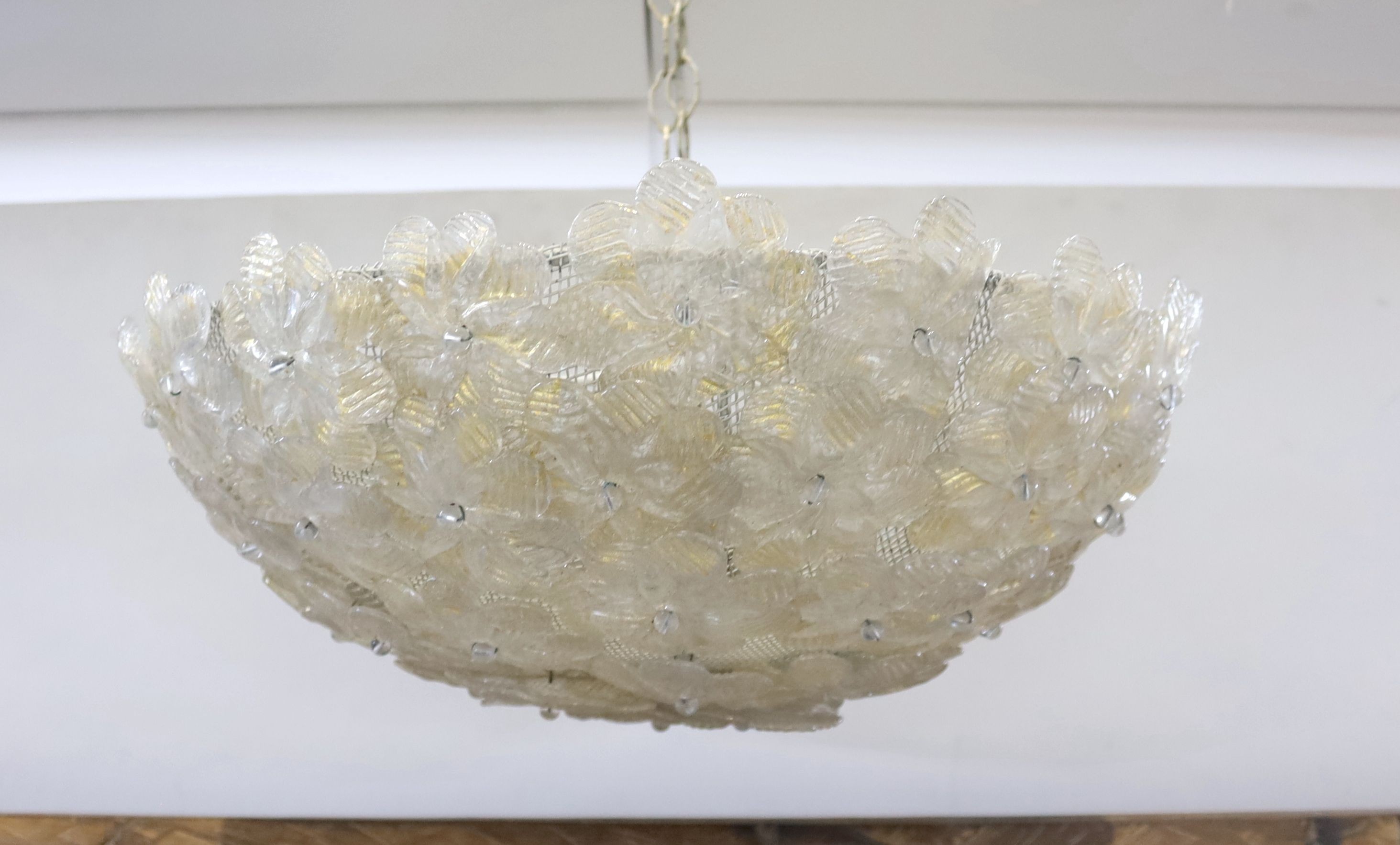 A 1960's Venetian gilt glass flower petal plaffonier, possibly Murano, 40 cms diameter. diameter 42cm.